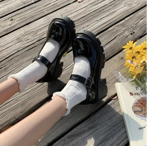 Women's buckle British style patent leather shoes in beige with round toe and low top, side view