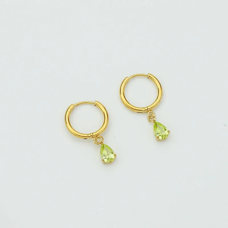 Drop-shaped zircon earrings in seven colours on a woman's earlobe titanium steel geometric design