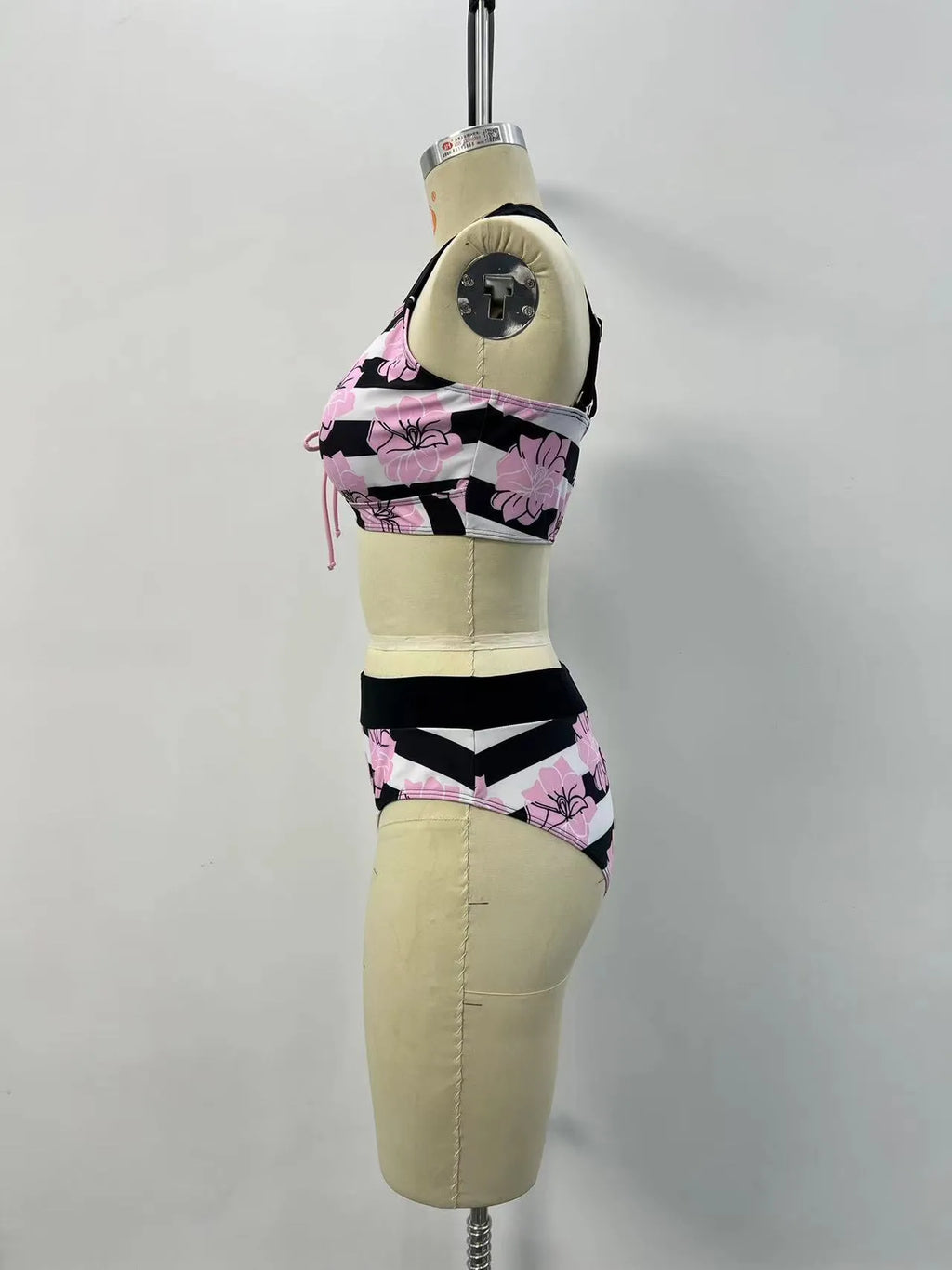 Black women's split bikini with printed belly coverage design for swimming