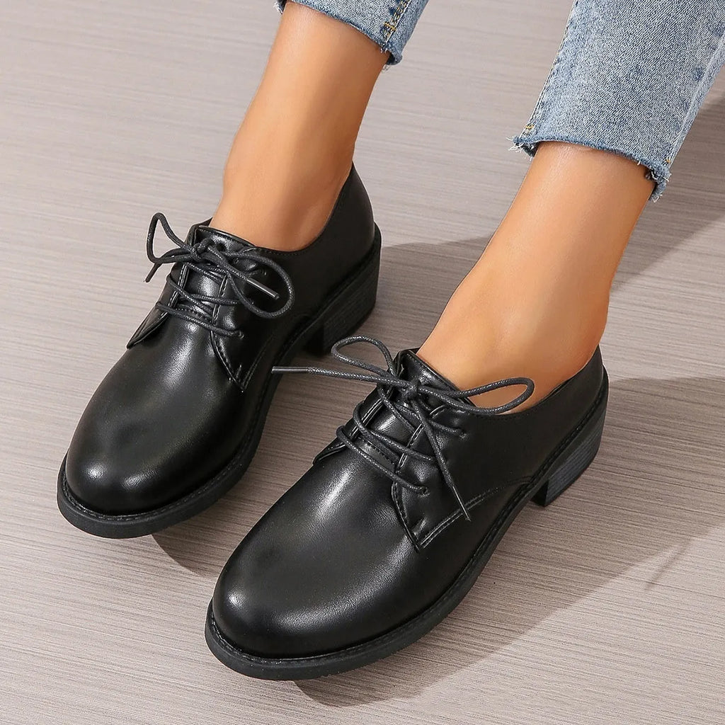 Black women's professional work shoes with chunky heel and low top design