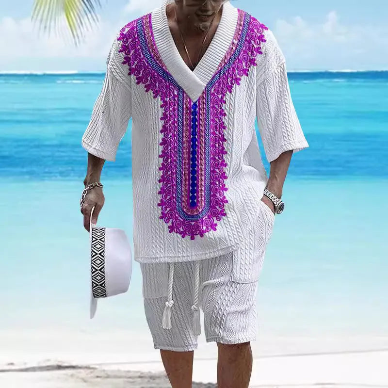 Man wearing a printed drop-shoulder knitted top and matching shorts from a leisure suit set.