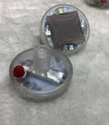 Colourful solar-powered LED hub decorative light for vehicle wheels, shown with installation screws.