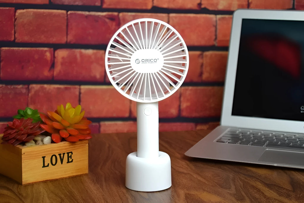 White ORICO FH1 portable USB rechargeable small fan on a desk