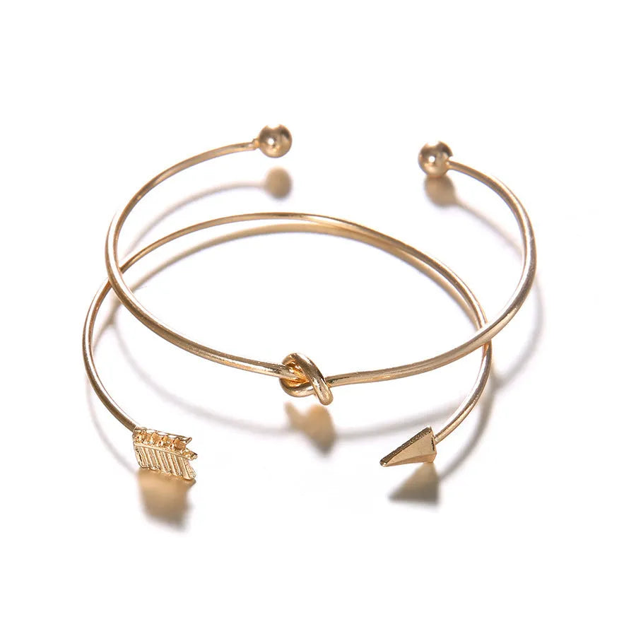 Gold vintage arrow knotted cuff bracelet for women with electroplated alloy construction