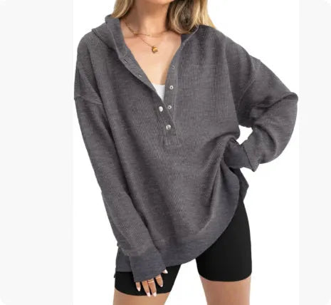 Women's loose fit raglan sleeve pullover sweater in peacock green, shown on a hanger.