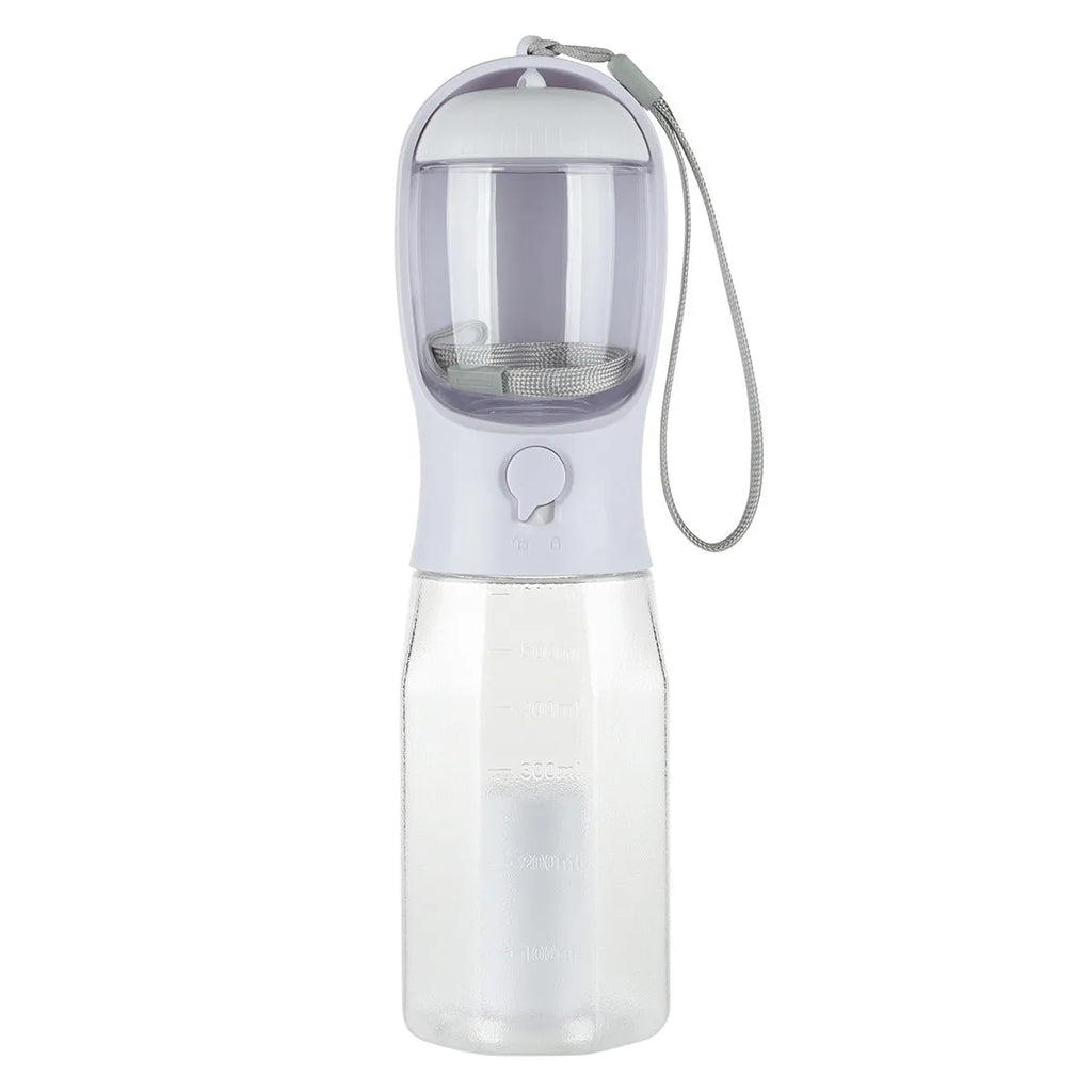 Turquoise portable 3-in-1 dog water bottle with food feeder and built-in poop bag dispenser on a walk