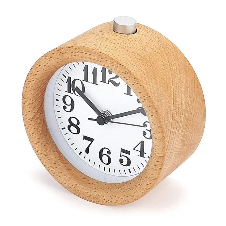 Solid beech wood analogue alarm clock with silent snooze on wooden surface