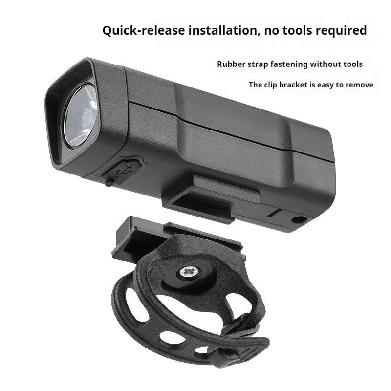 USB rechargeable bicycle headlight with quick release strap mount showing LED light