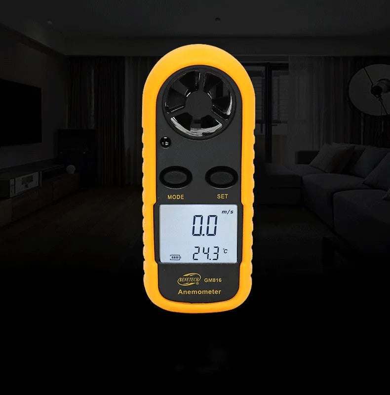 Orange digital portable wind speed measuring instrument showing display and compact handheld design