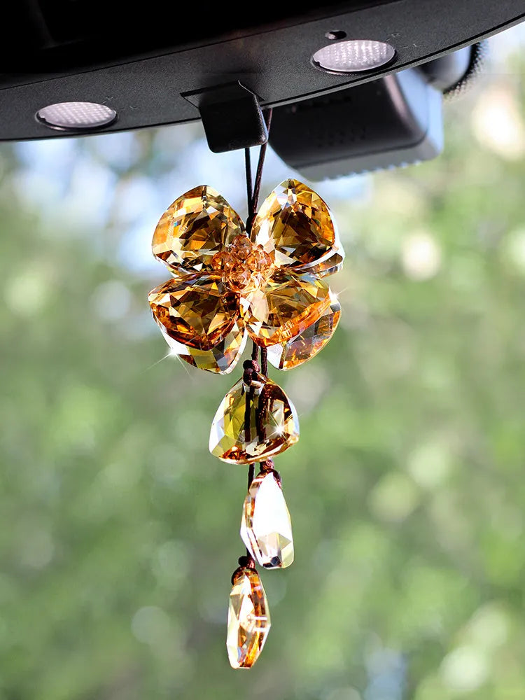 Crystal Four Leaf Grass car interior hanging pendant approximately 20cm long on a clear background.