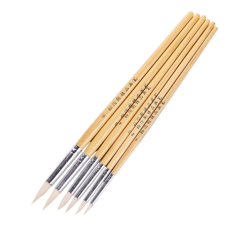 Set of six wooden-handled artist brushes with pointed synthetic wool bristles on a white background.