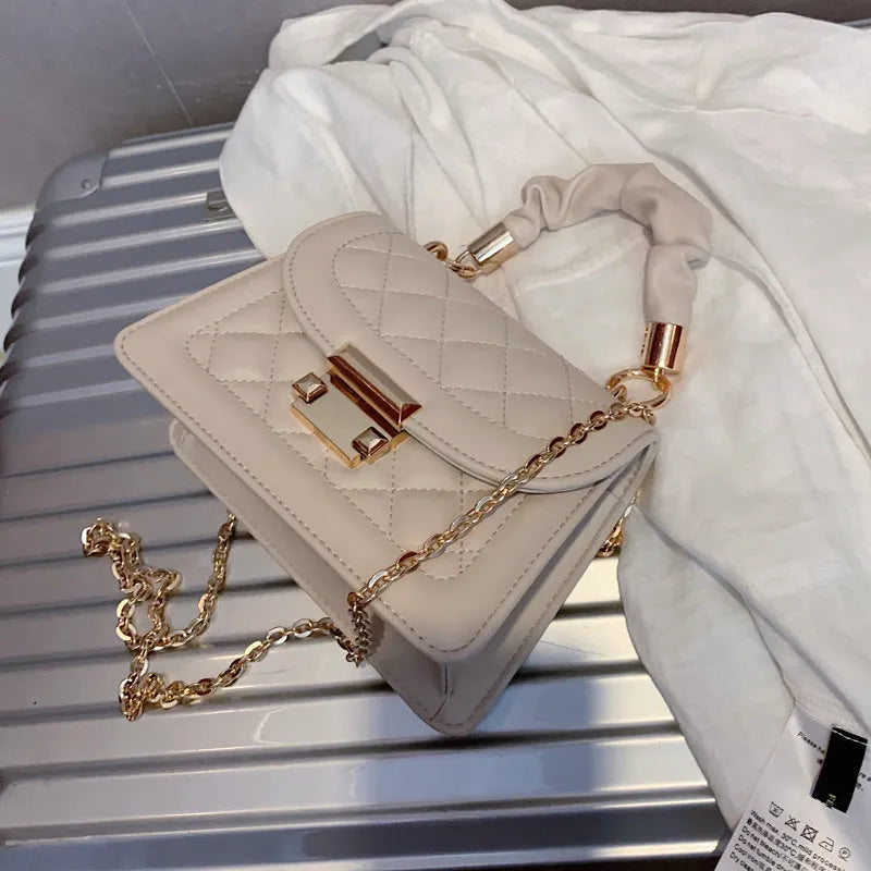 Korean-style small square shoulder bag in purple with chain detail and soft PU construction