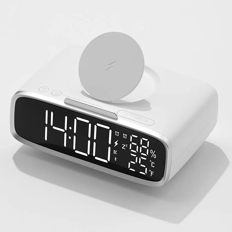White wireless charger bluetooth speaker with LED night light and alarm clock display on flat surface