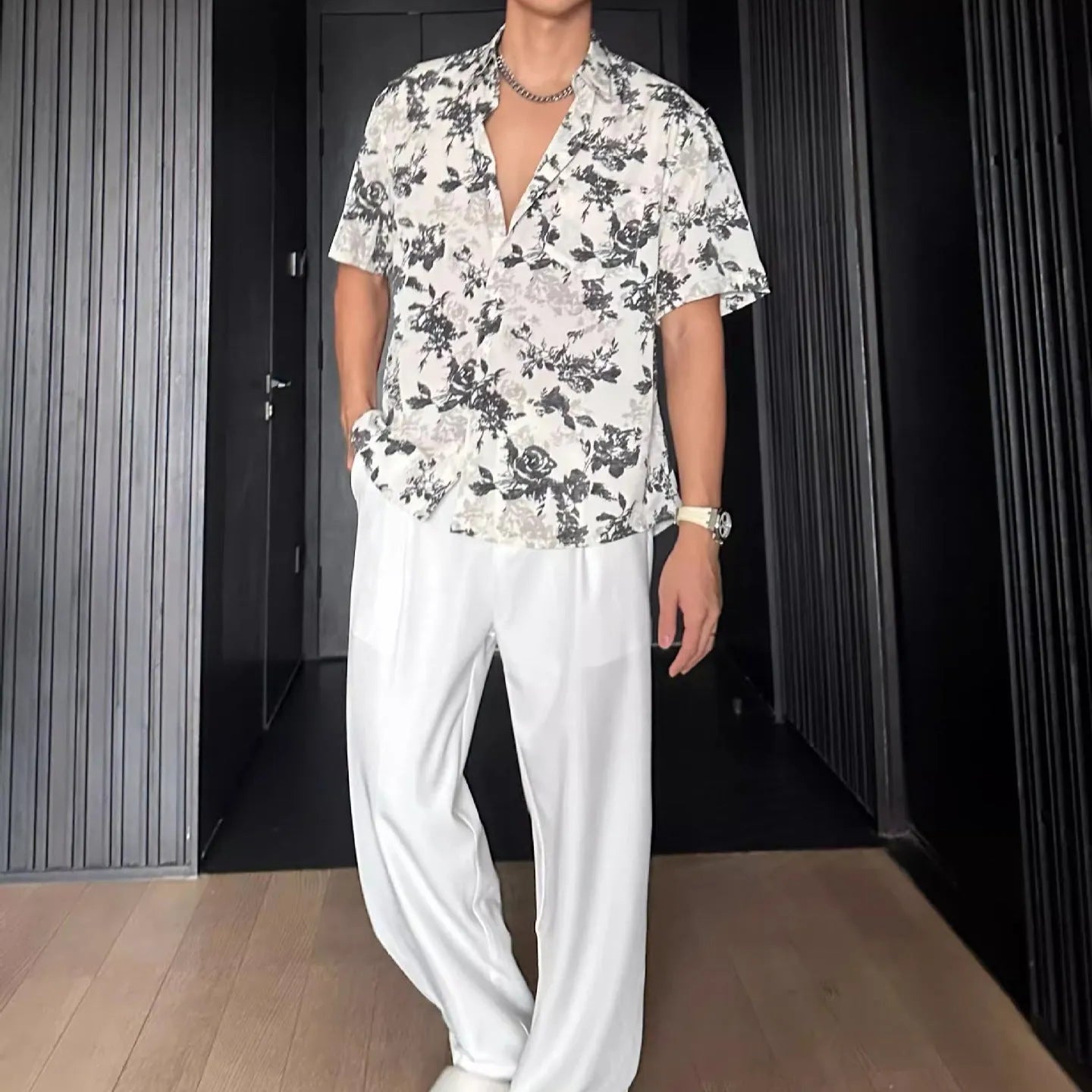 Loose-fitting white women's short sleeve shirt with a floral print pattern.