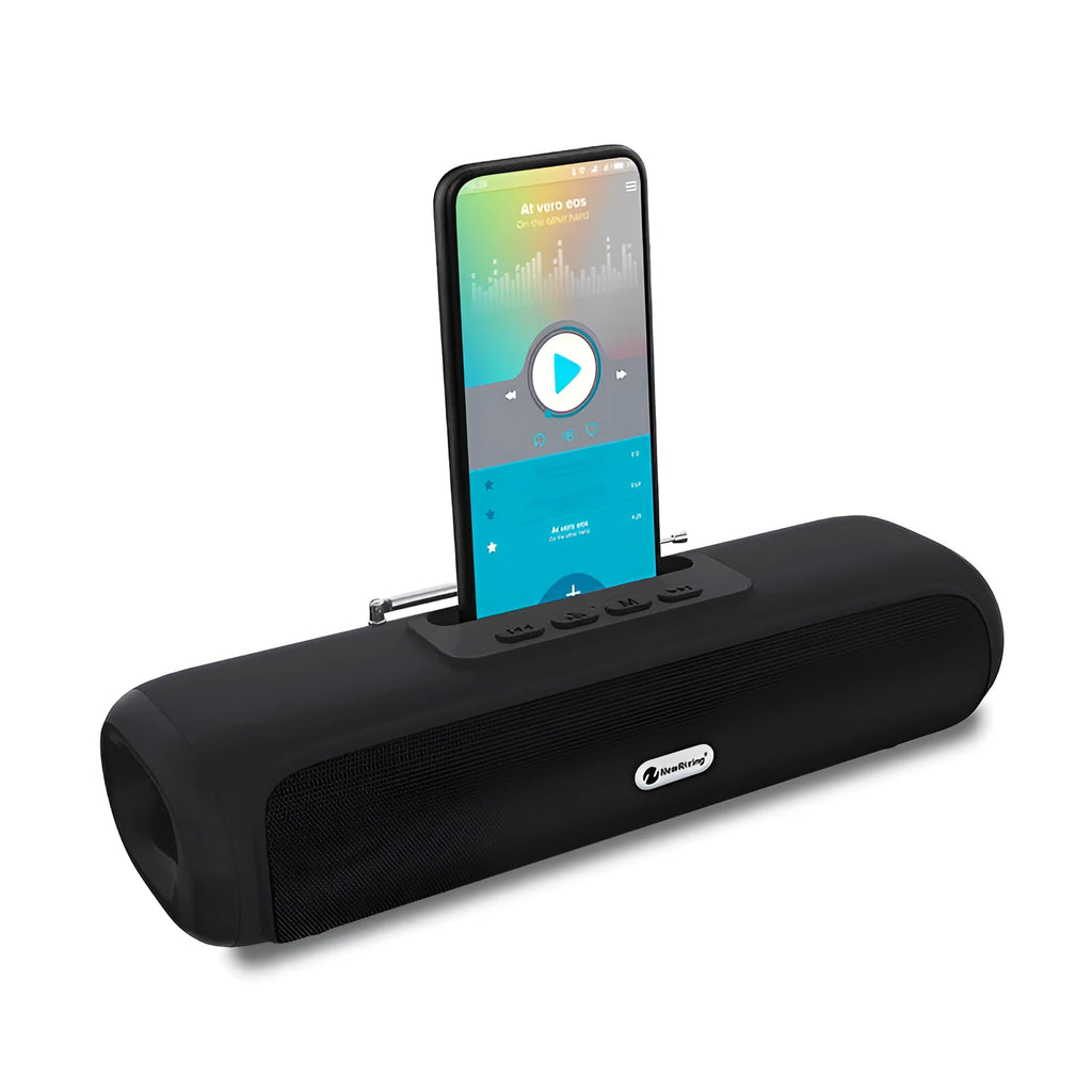 Long, slim wireless desktop Bluetooth speaker in black, shown on a wooden desk.