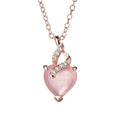 Women's pink heart crystal pendant necklace with rose gold chain on white background