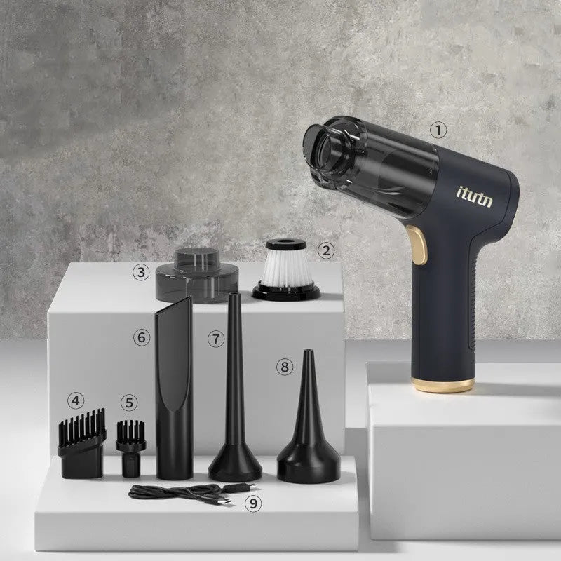 Black wireless handheld car vacuum cleaner and tyre inflator with multiple nozzle attachments on a white background.