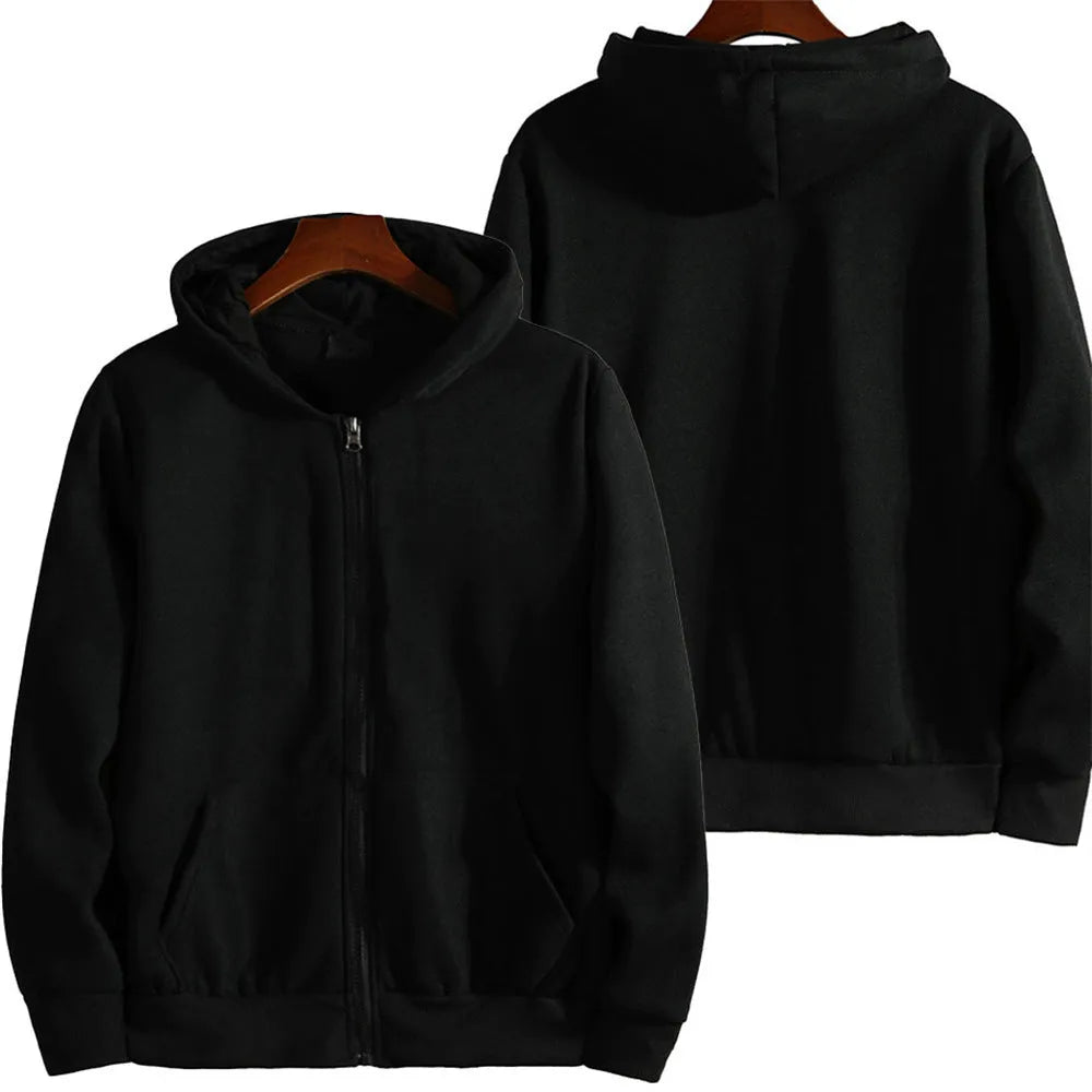 Man wearing a solid colour loose fit zip-up sports jacket in a casual setting.