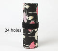 Canvas rolling pencil case with ballet girl print, showing multiple pencils organised in holes.