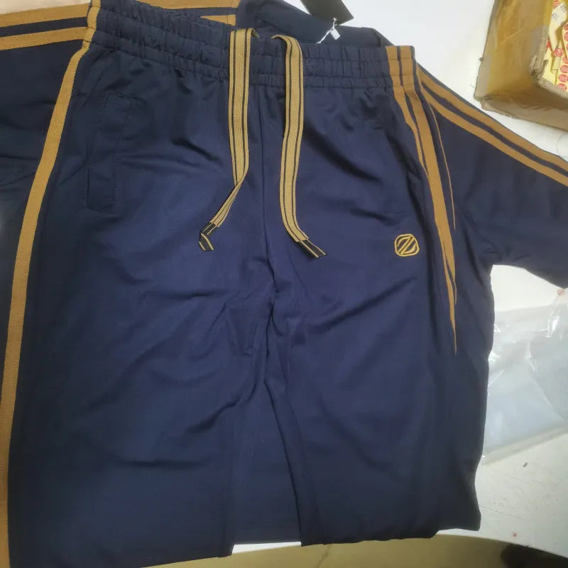 Man wearing a blue ice silk style short sleeve suit top and trousers set.