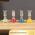 Transparent coloured glass trumpet pipe measuring 7cm length in geometric design.