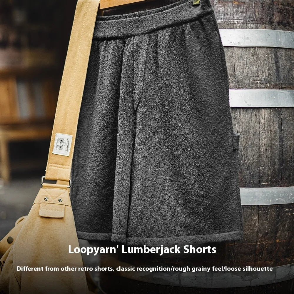 Cement grey men's straight-leg sports shorts with elastic waistband showing fifth-pants length measurement