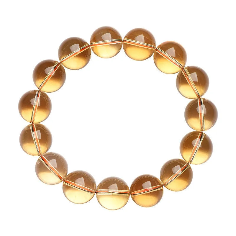 Natural honey-yellow citrine bead bracelet with hand-knotted cord, shown in scattered bead style.