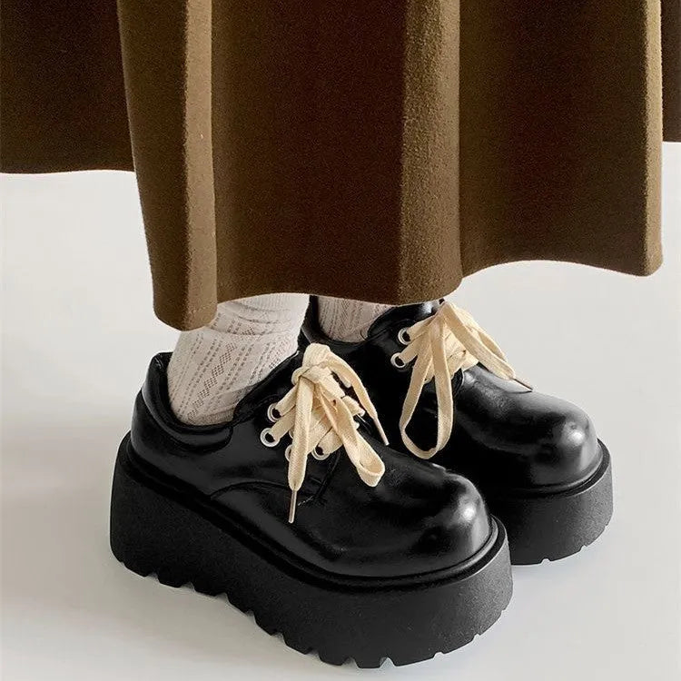 Matte black women's lace-up shoes with a chunky 6-8cm heel and round toe on a white background.