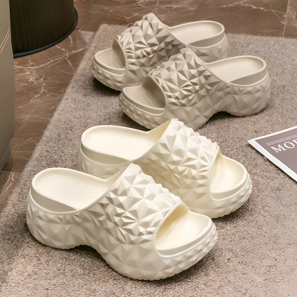 Khaki coloured EVA high heel flip flop slippers with a thick, textured sole.