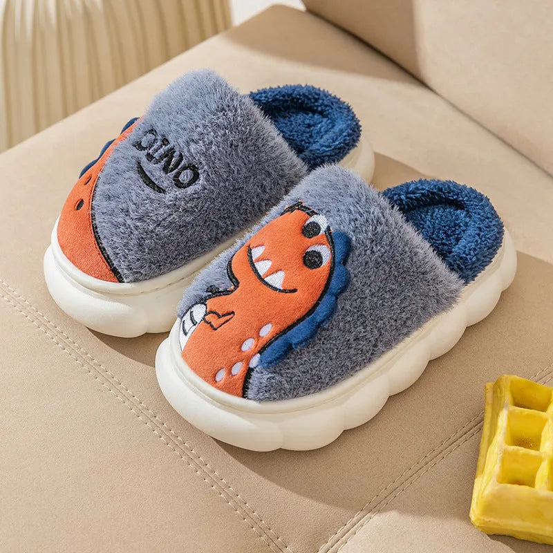 A pair of plush dinosaur-themed slippers for indoor wear, shown in a choice of colours.