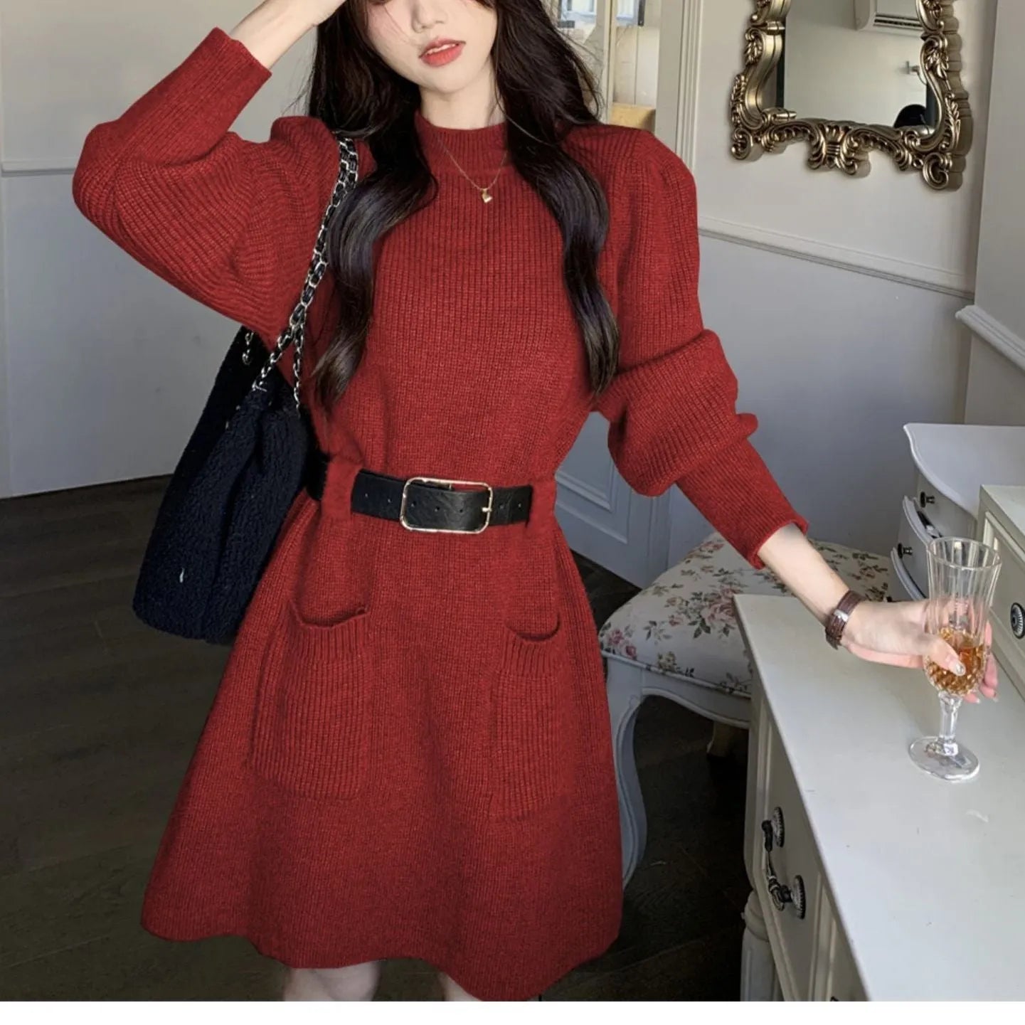 Women's loose knitted dress with long sleeves and high waist, shown in beige with black belt