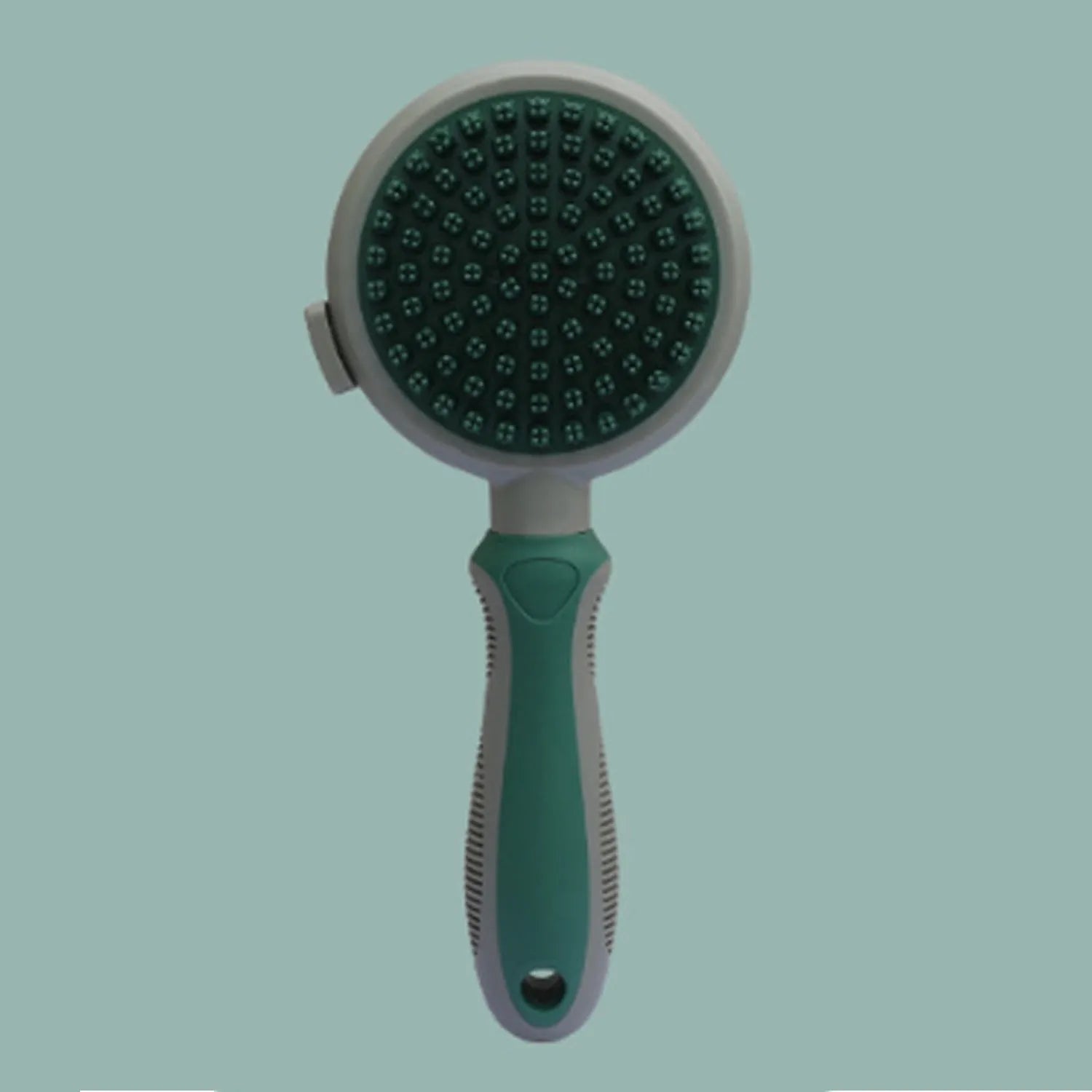 Green and pink double-sided cat brush with release button and a separate flea comb on a white background.