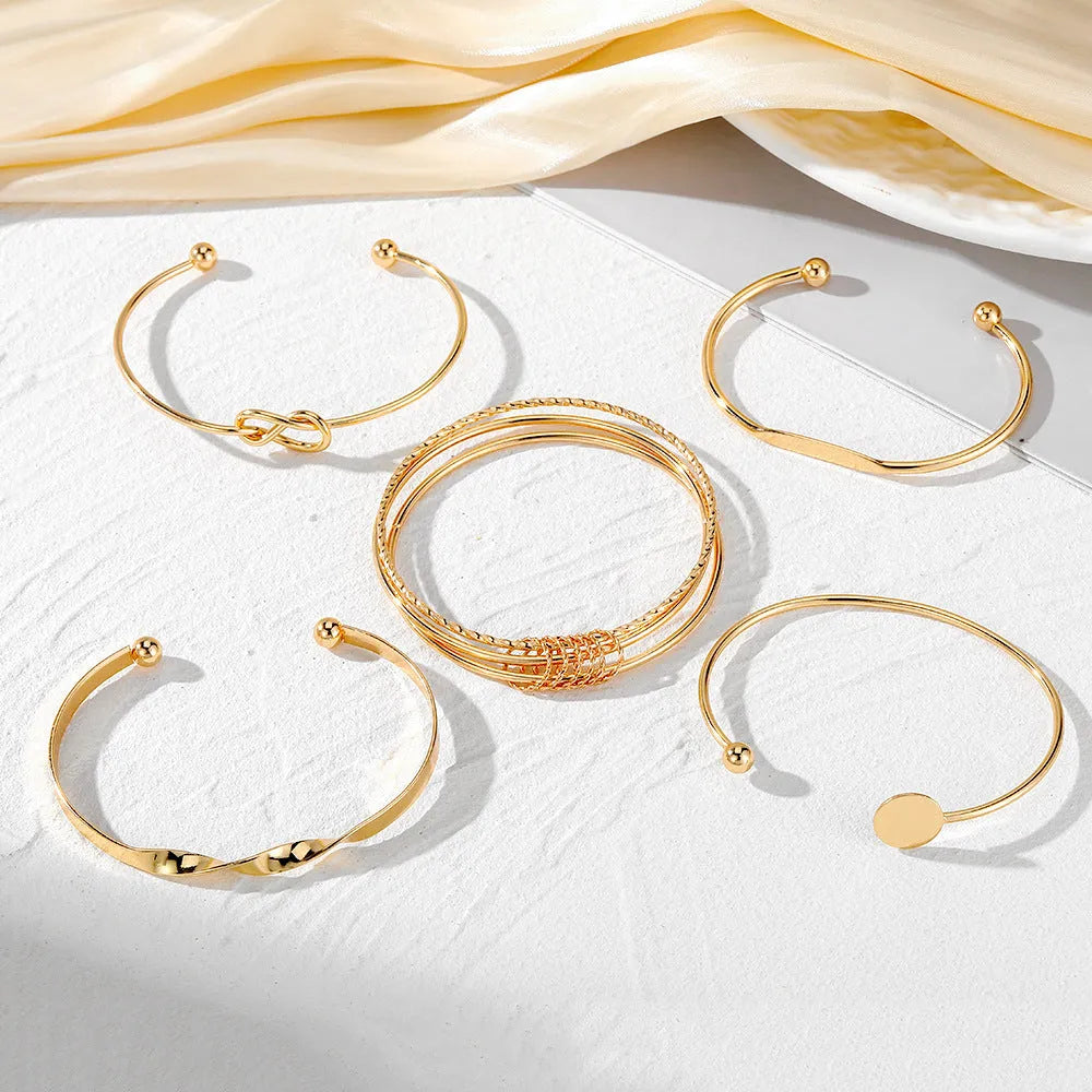 Set of five retro chain bracelets with geometric round, dot, and ring elements in electroplated alloy finish, HS1226 colour.