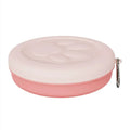 Collapsible two-layer silicone dog travel bowl in light pink and green, showing food and water compartments.