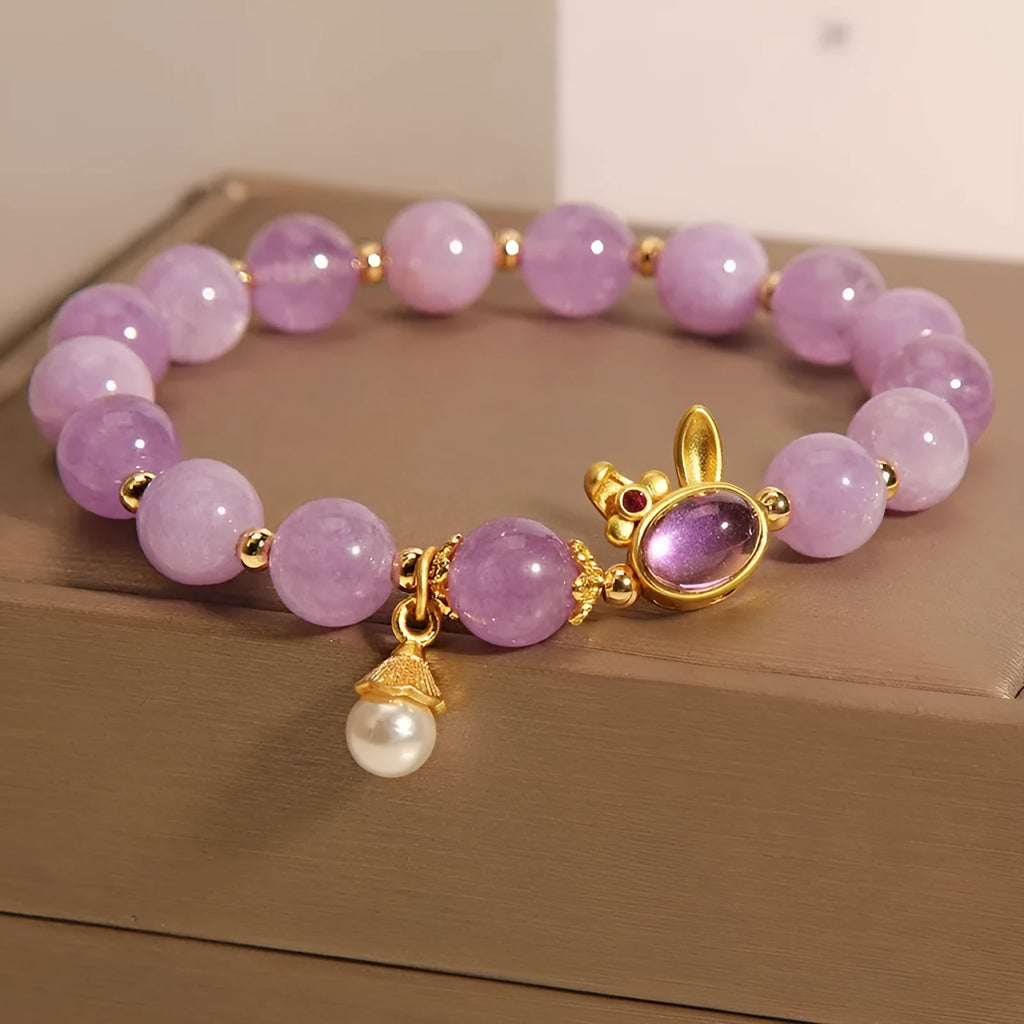 Purplish red jade rabbit hare head charm on a crystal Mori style bracelet.