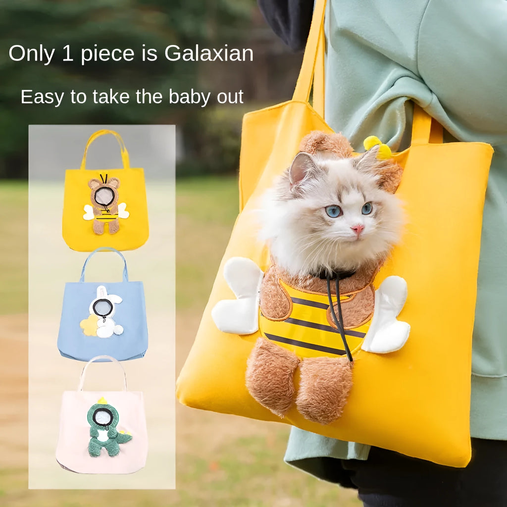 Blue canvas pet carrier shoulder bag with an open side showing a cat's head, featuring safety zippers and an animal print design.