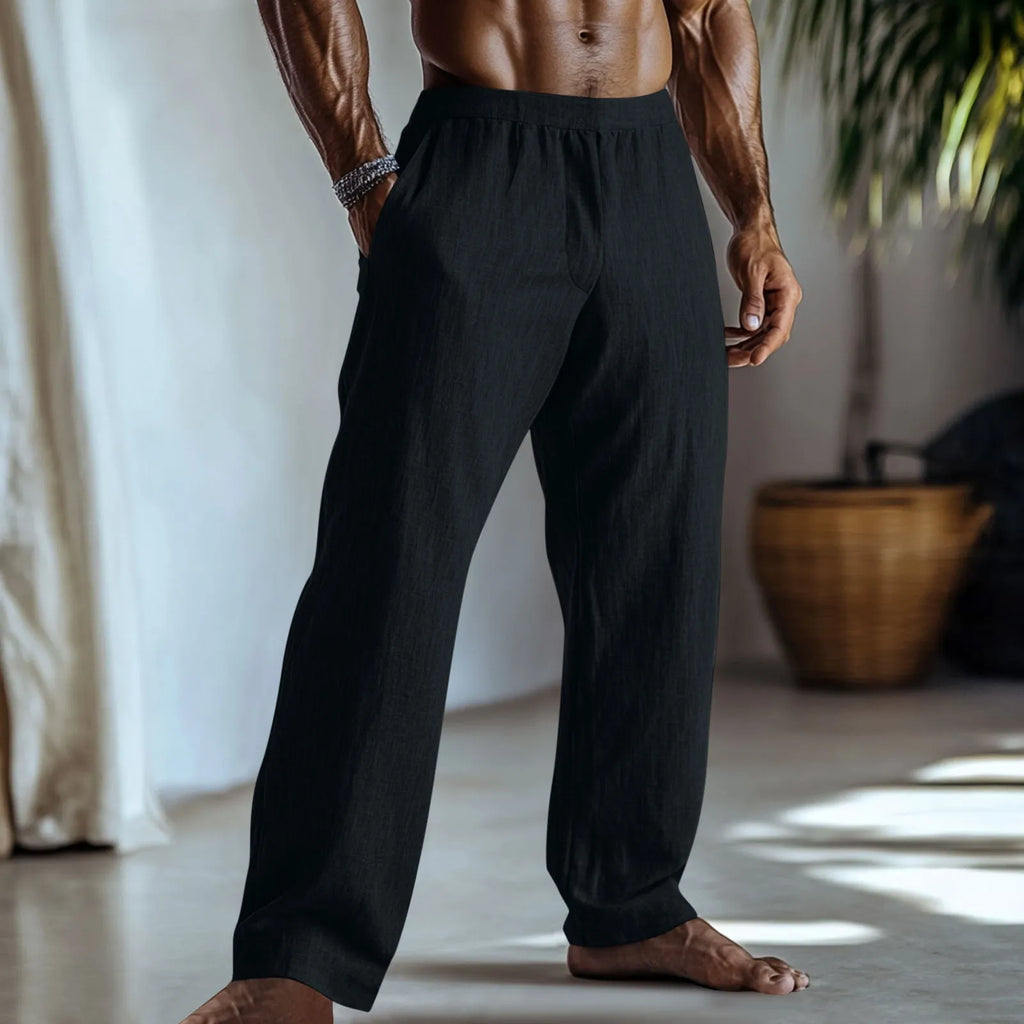 Straight-leg cotton linen trousers in light green on a hanger