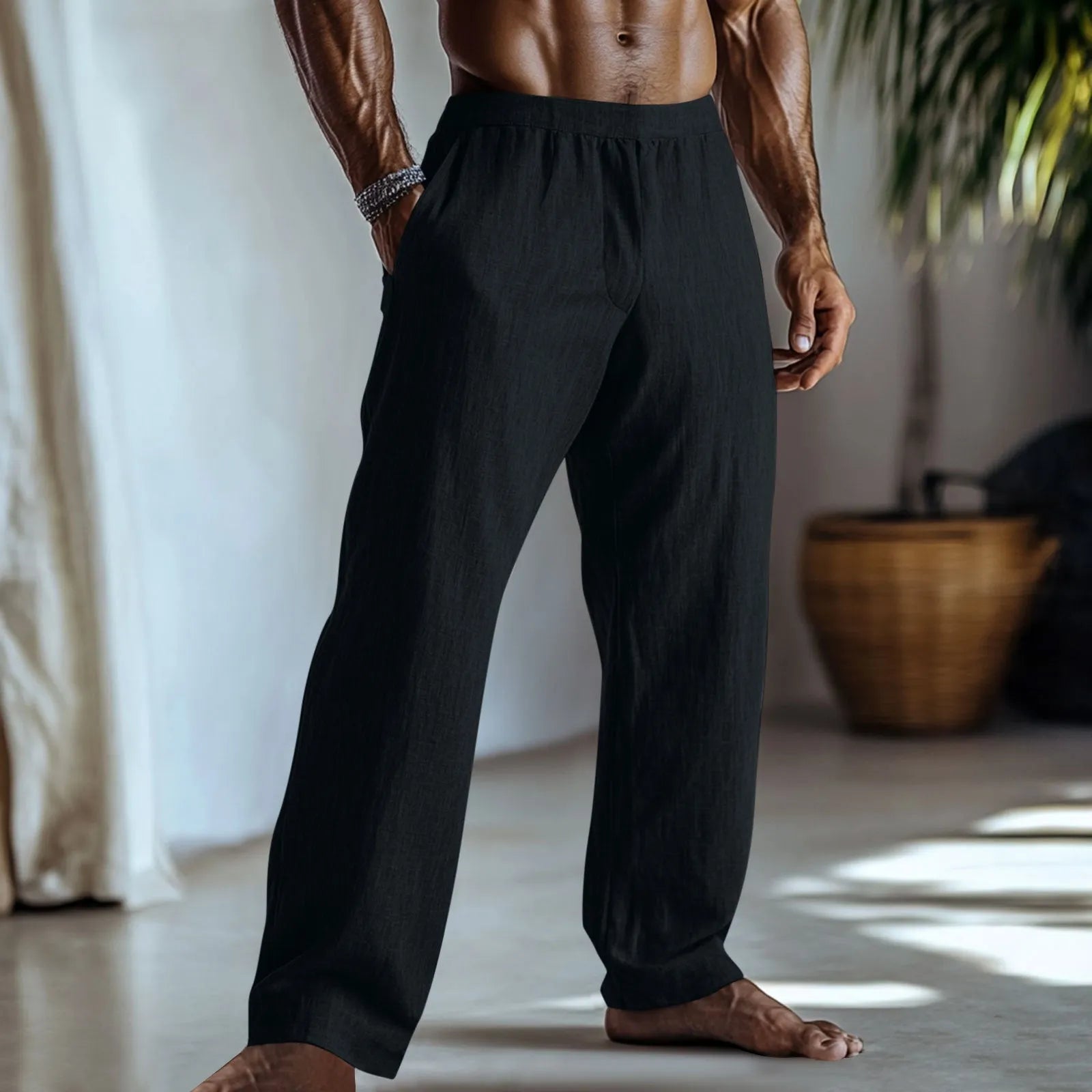 Straight-leg cotton linen trousers in light green on a hanger