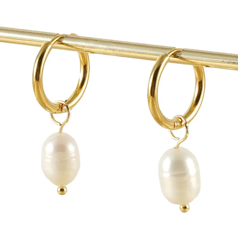 Gold geometric stainless steel earrings with a white pearl accent for women.