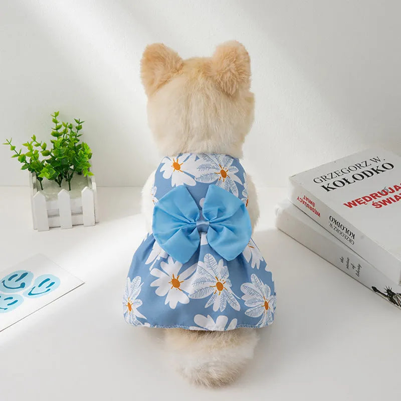 Ultra-thin floral butterfly knot princess dress for a dog or cat in summer, shown with a blue bow.