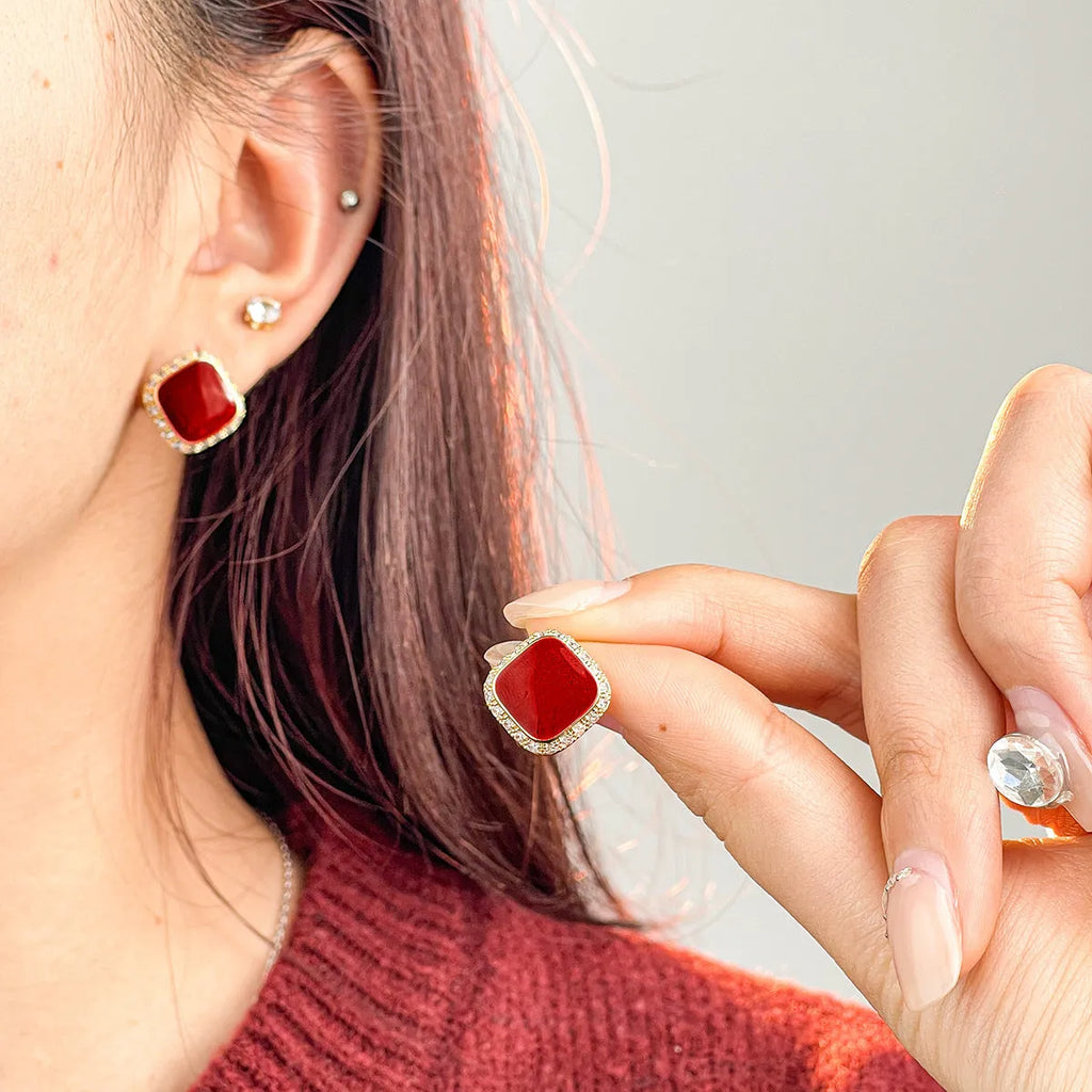 Retro red alloy earrings with geometric square inlaid design for women.