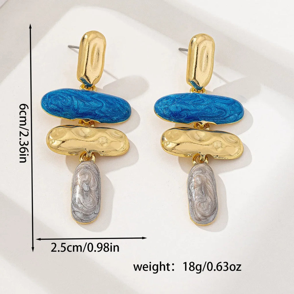 A pair of women's geometric stud earrings with a multicolour electroplated finish on a zinc alloy base.