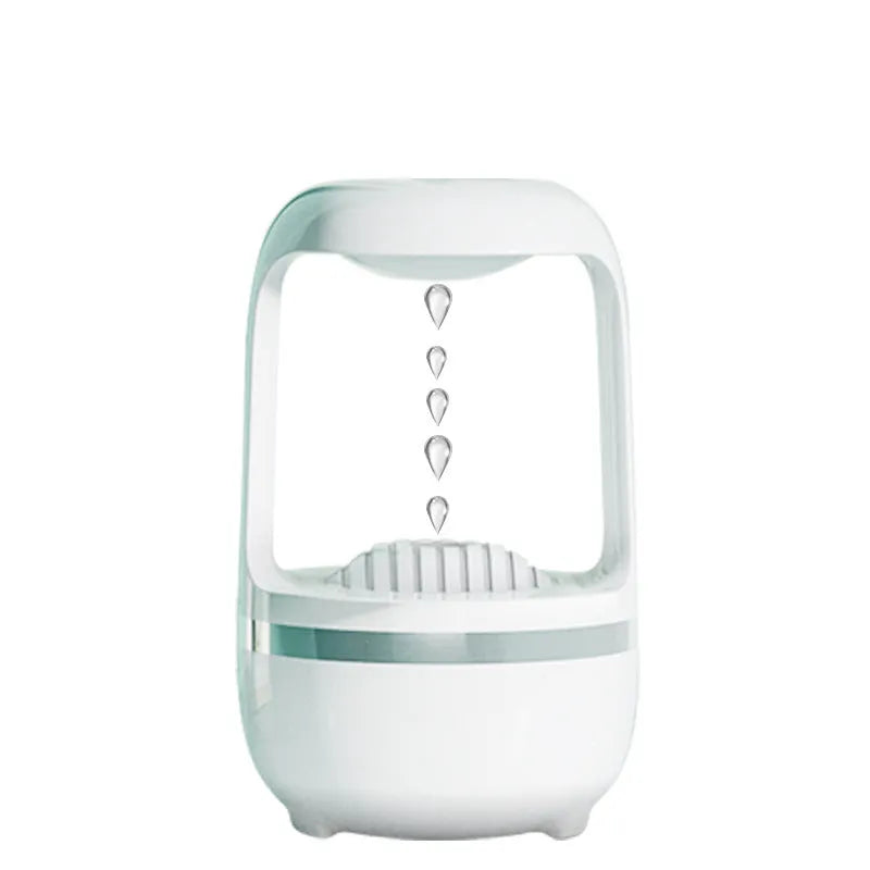 White anti-gravity humidifier showing water droplets flowing upwards, with USB cable and 500ml water tank.