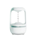 White anti-gravity humidifier showing water droplets flowing upwards, with USB cable and 500ml water tank.