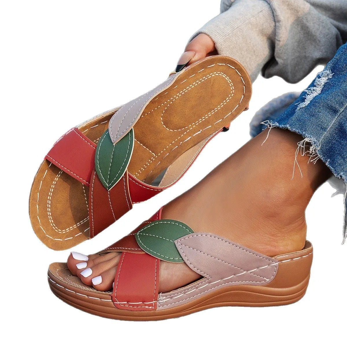 Women's black thick-soled slippers with a cross-strap and peep-toe fish-mouth design on a white background.