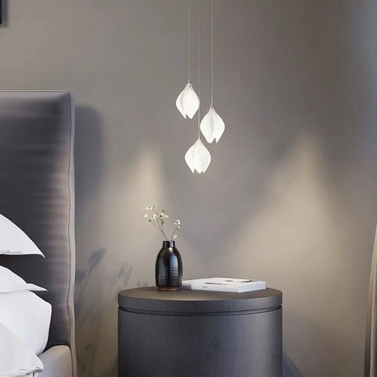Ceramic magnolia petal shaped single pendant light with minimalist design.