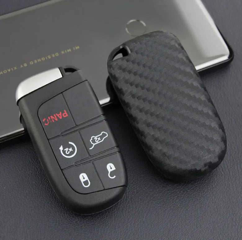 Black silicone car key case with carbon fibre pattern for Dodge, Chrysler, Fiat remote, shown with buckle option.