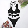 A solid colour women's bikini swimsuit with straps, shown in one of five available colours.