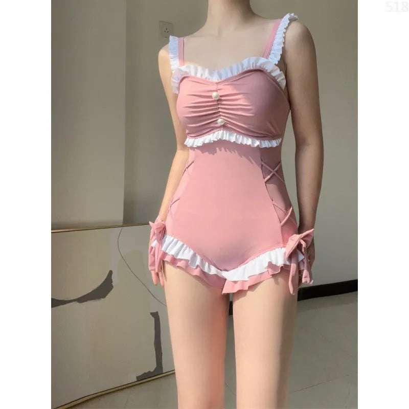 Women's one-piece sun protection swimsuit in milk silk fabric, solid pink colour, sleeveless style