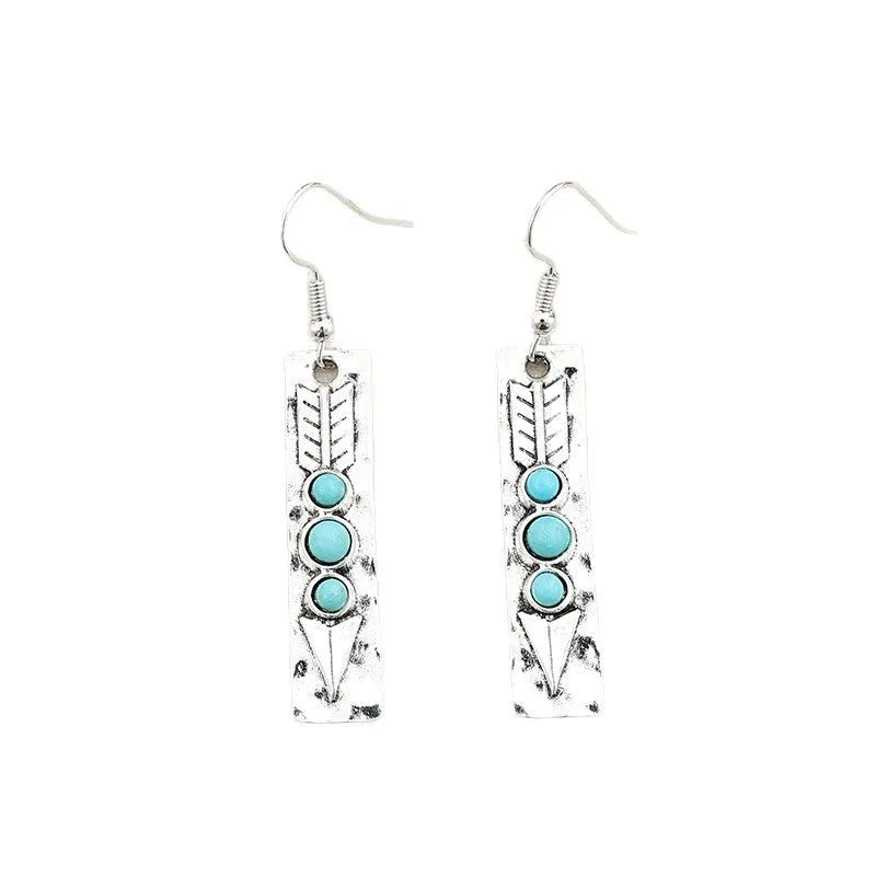 Silver geometric drop earrings with turquoise inlay detailing on long strip design